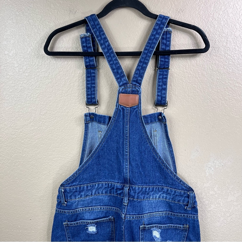 Distressed women’s denim overalls - Picture 5 of 7